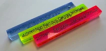 Three Detectronic test sticks colour-coded by material and marked with diameter and certificate number